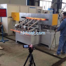 auto feeding system for induction forging steel rods