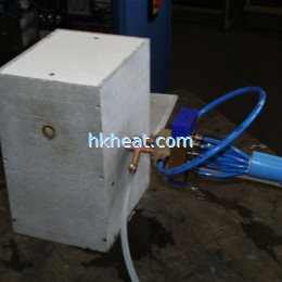 induction coil mounted in an isolation box